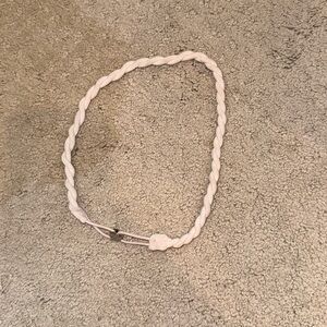 Lululemon twist headband in light pink. Discontinued style